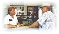 Owner Mike Bailey helping a customer